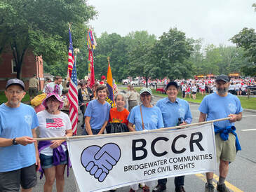 July 4, 2023 BCCR Marched in Bridgewater's July 4th Parade. Individuals are holding a Bridgewater Communities for Civil Rights banner.