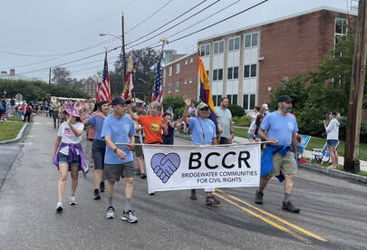 July 4, 2023 BCCR Marched in Bridgewater's July 4th Parade. Individuals are holding a Bridgewater Communities for Civil Rights banner.
