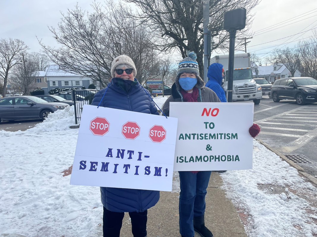BCCR members hold signs saying “Stop stop stop Antisemitism,” “No Islamophobia, no Antisemitism, End Hate.”