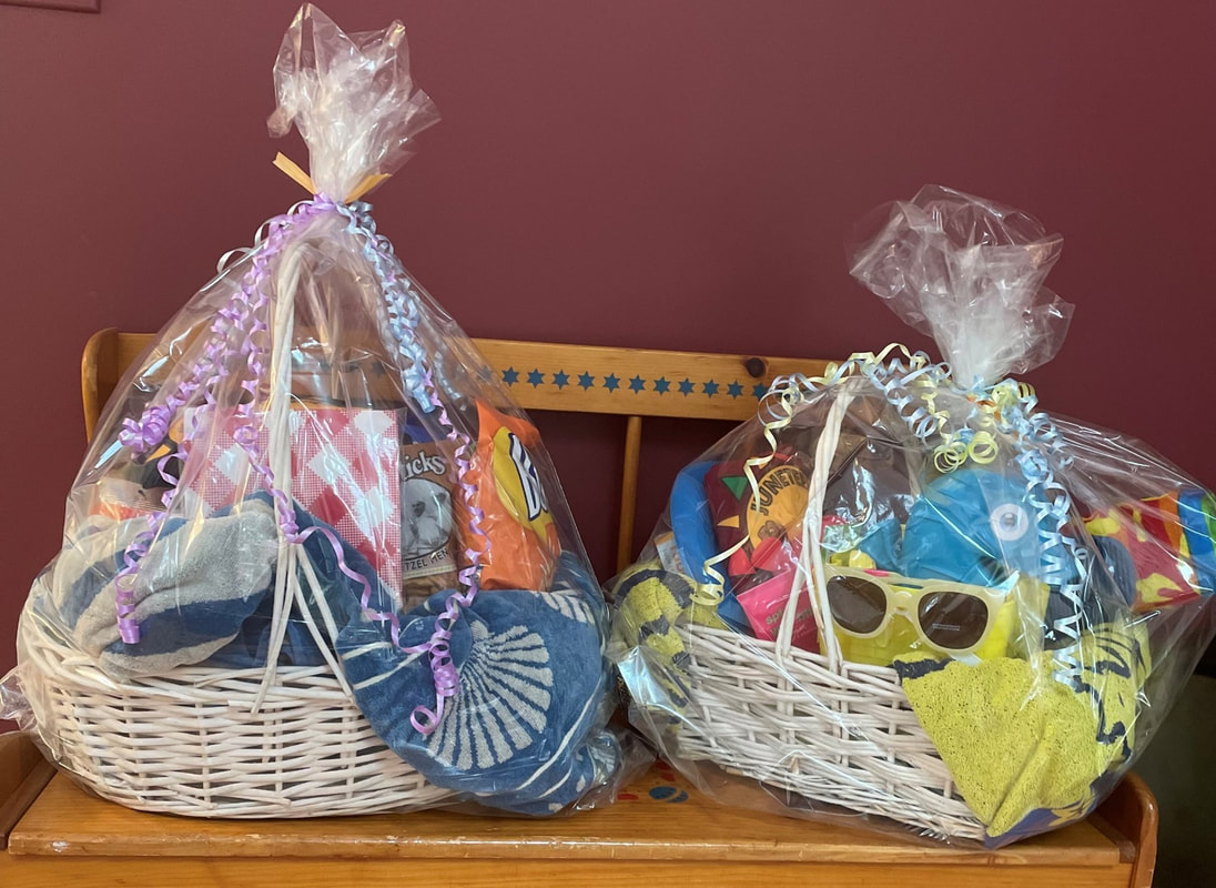 Photograph of two raffle baskets filled by Juneteenth members.
