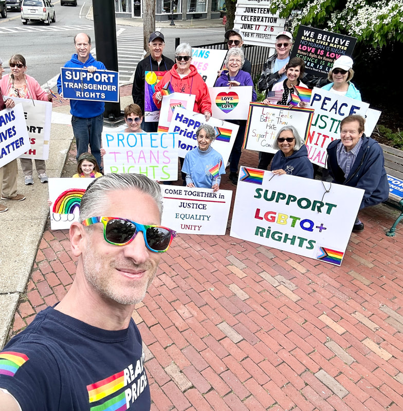 June 10, 2023 LBGTQ+ Standout described in text surrounding photo. Individuals are holding signs saying, 