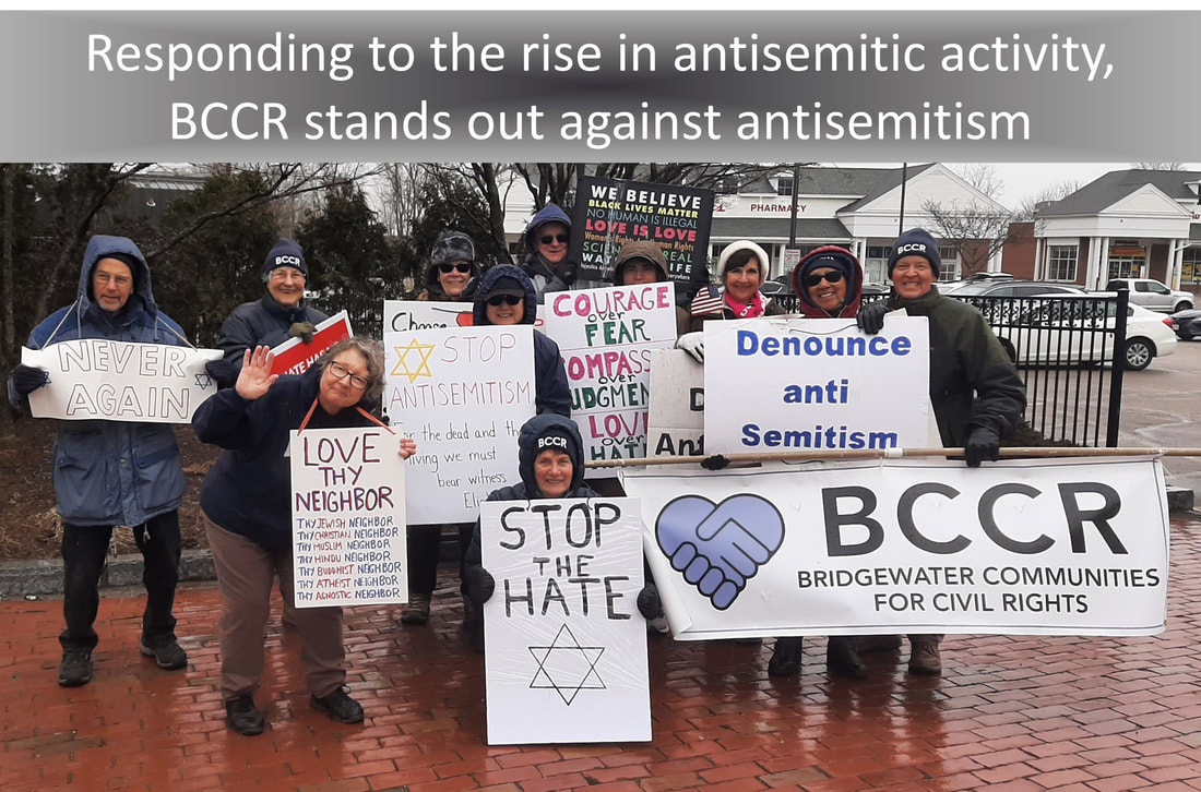 BCCR members hold signs such as: 