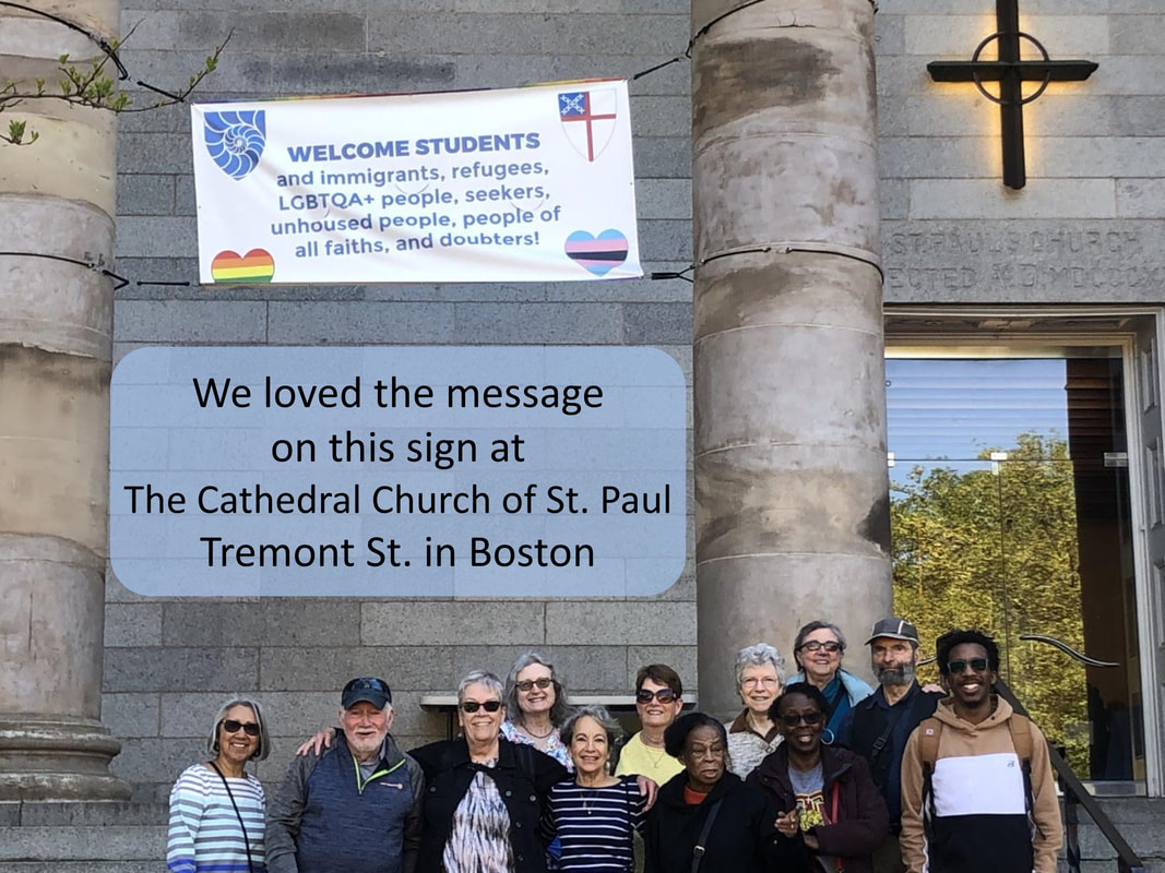 BCCR members stand under a sign in front of Cathedral Church of St. Paul, Tremont St. in Boston. The sign says, 